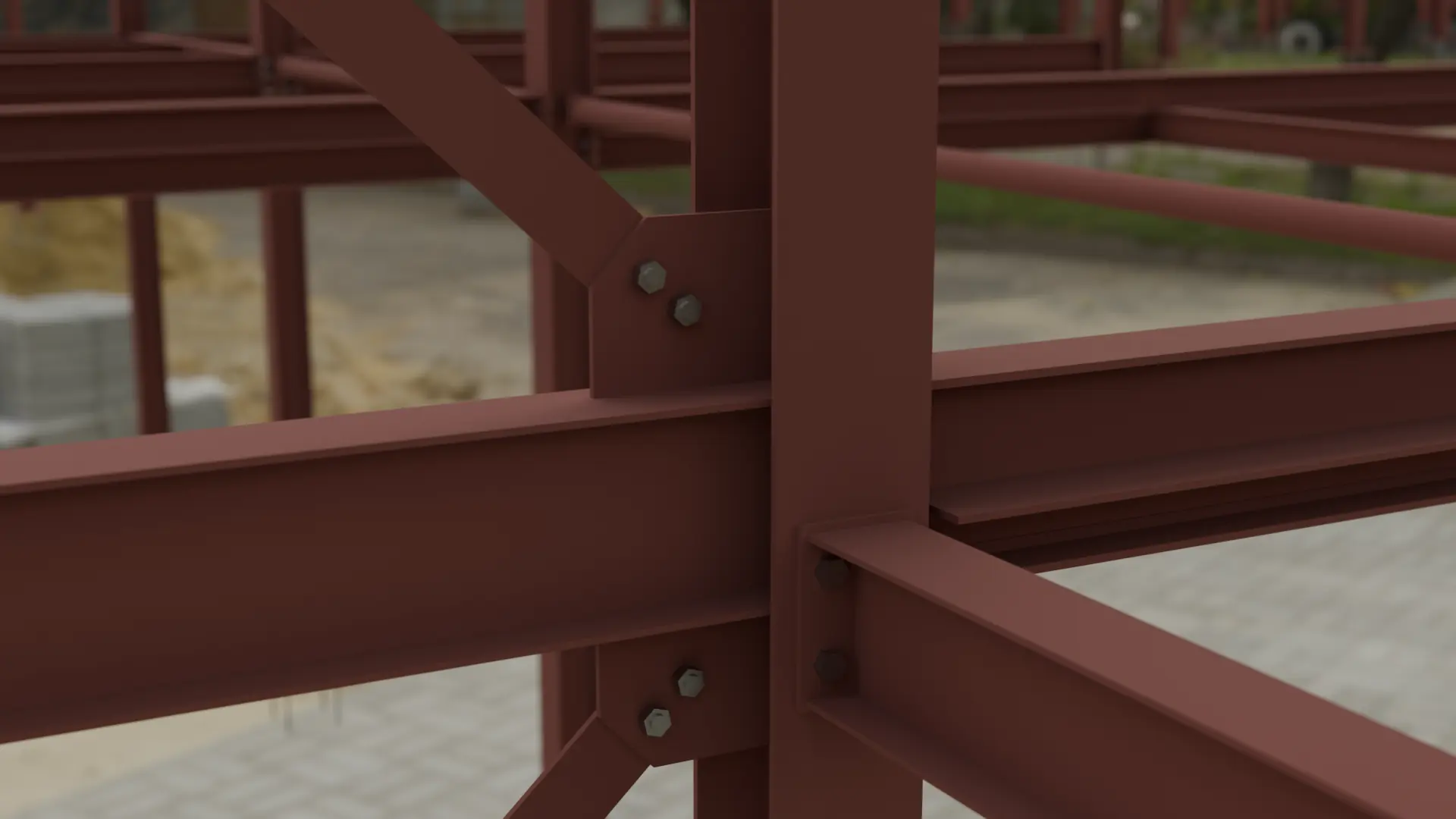 Close-up of bolted joints on a primed beam and column frame