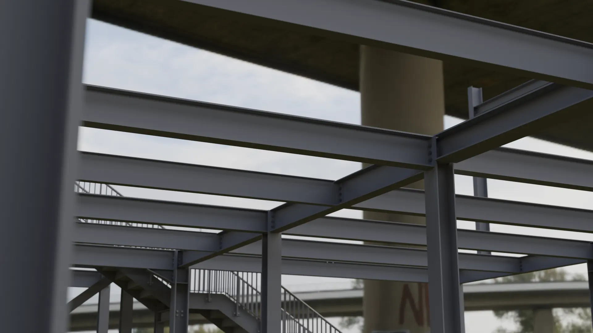 Multi-storey steel frame with an access stair under a concrete deck