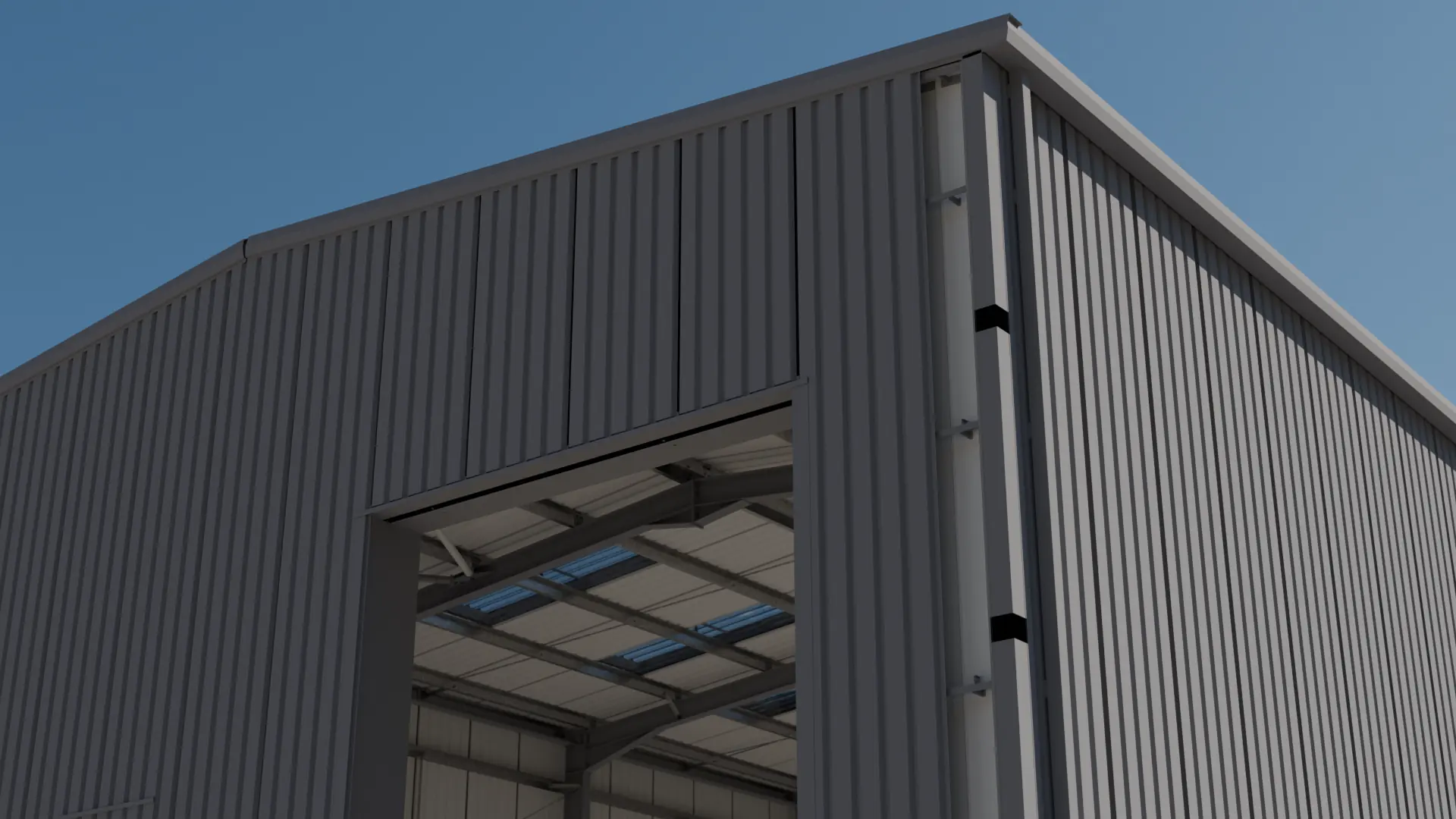 Clad portal frame building with a large framed door opening