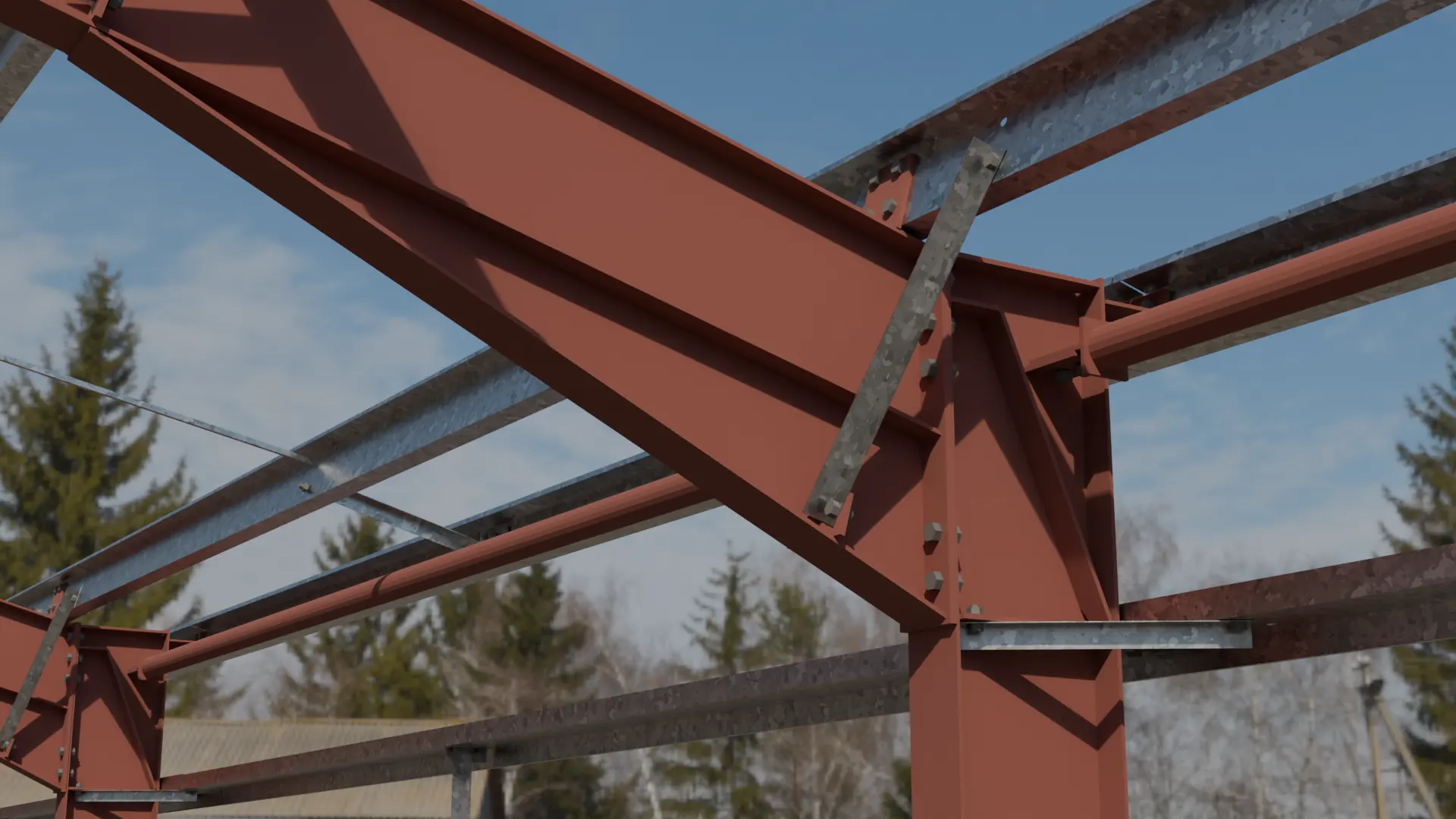Eaves haunch of a primed portal frame with galvanised purlins and fly bracing