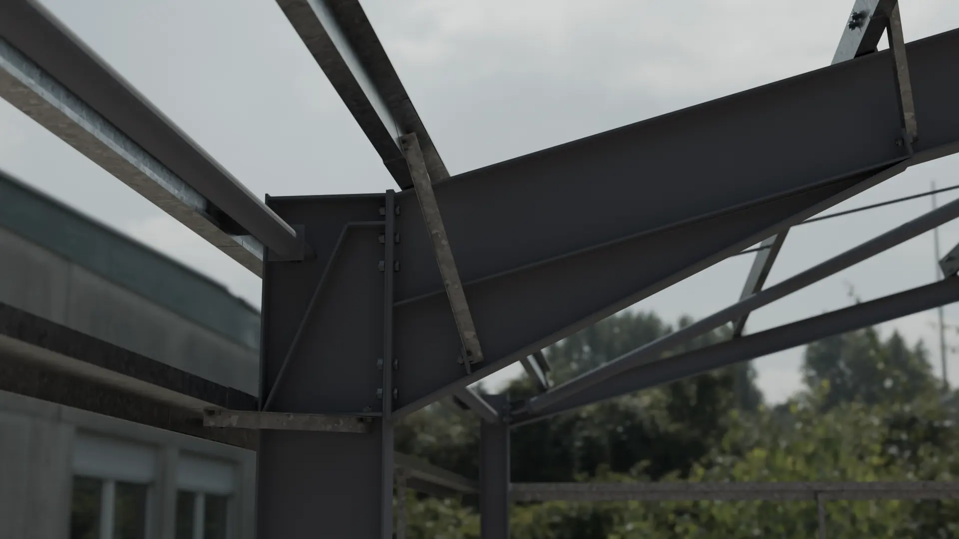 Grey painted portal frame knee connection with galvanised purlins